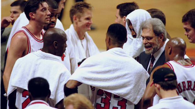 April 8, 1998; Chicago Bulls coach Phil Jackson with Scott Burrell Scottie Pippen, Michael Jordan, Toni Kukoc, Dickey Simpkins, Steve Kerr and Dennis Rodman